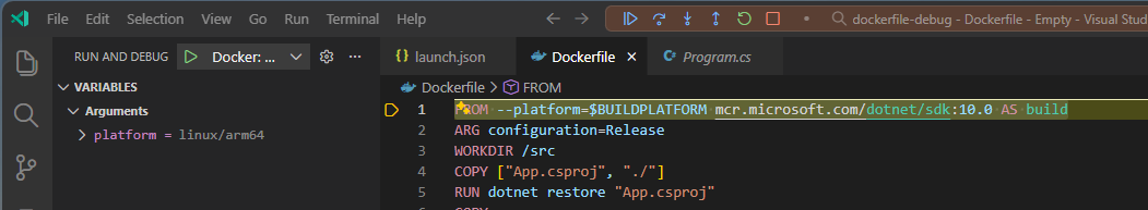 Screenshot showing dockerfile debugging with the platform variable set to linux/arm64 on the left and a Dockerfile with an active break point on the first line on the right